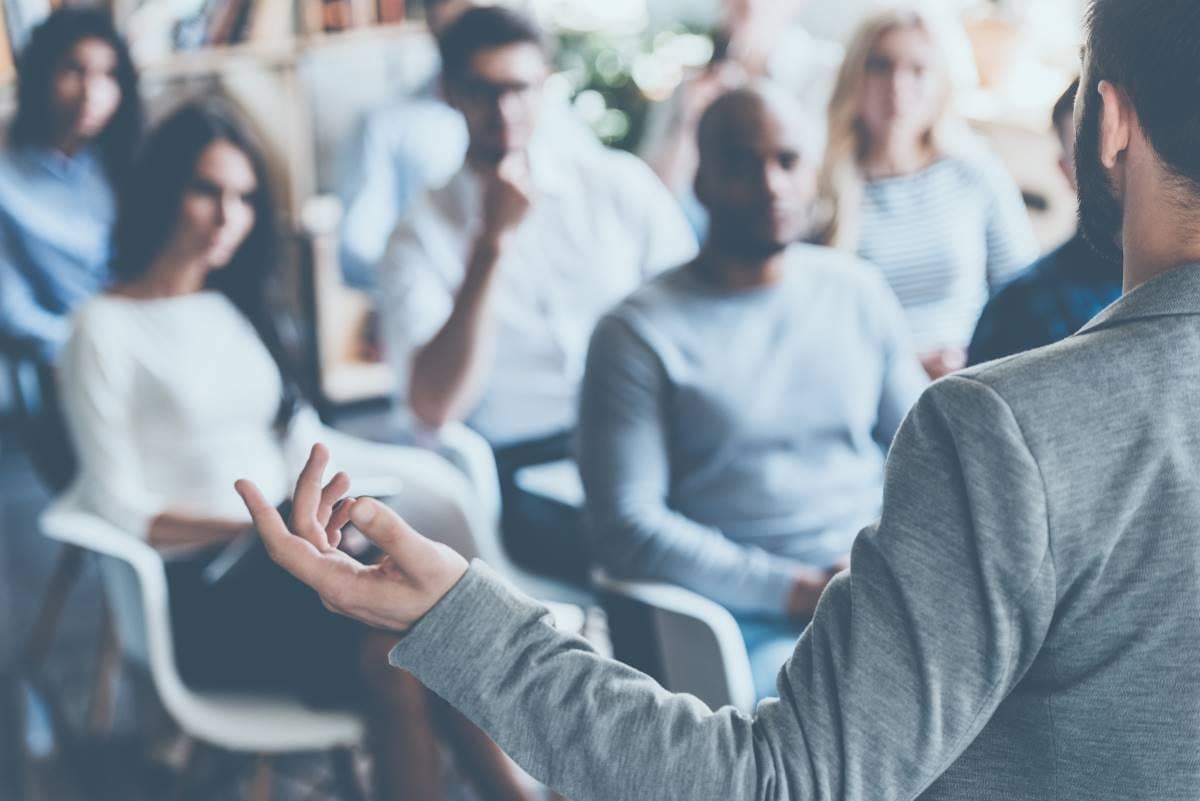 person doing a presentation in a professional environment