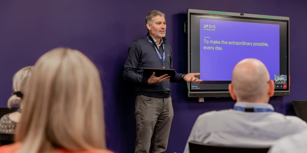 Managing Director Ian Holder speaking text to screen