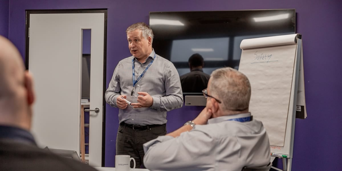 man presenting with paper board