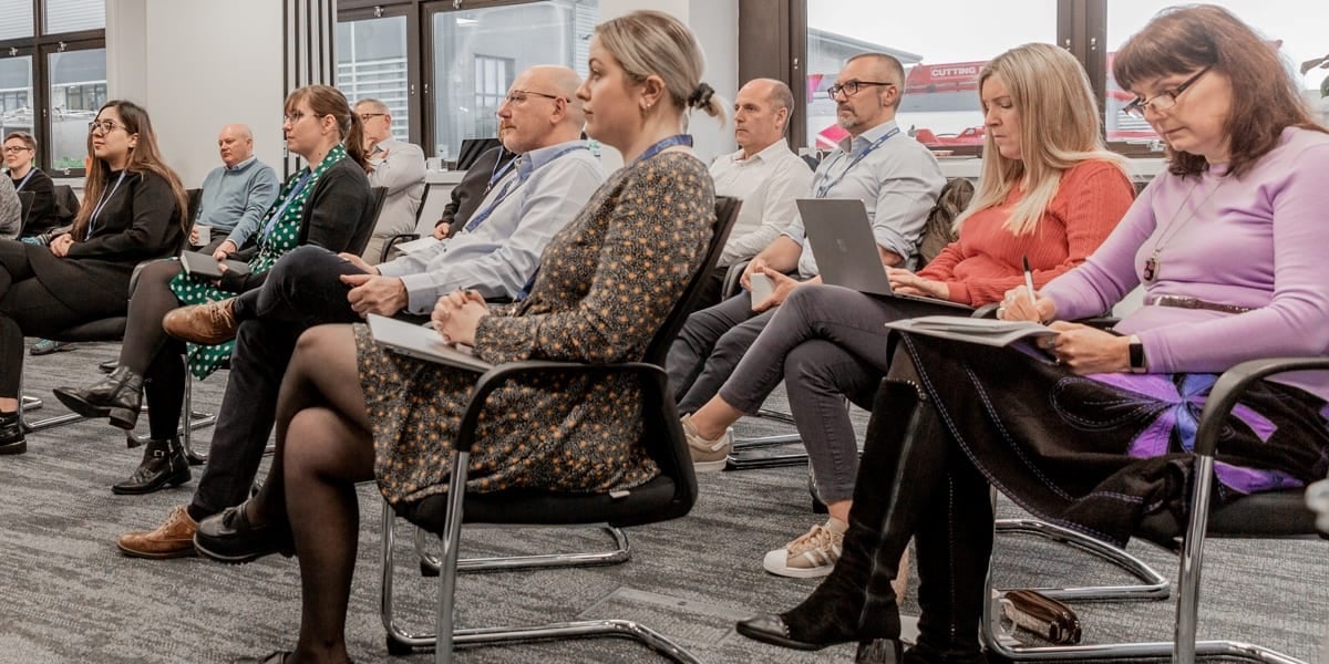 group of people sat on chairs